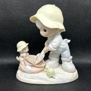 Precious Moments "Nothing Can Dampen The Spirit Of Caring " figurine
